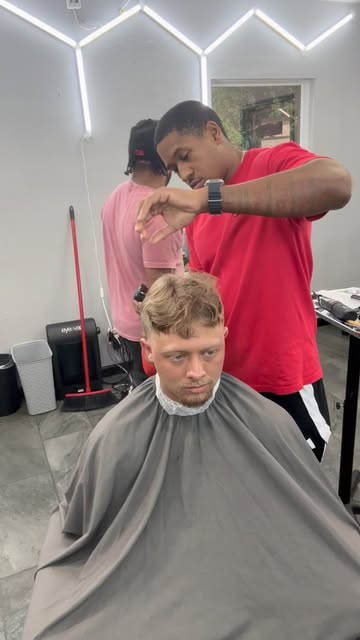 Barbers at work in The Luxe shop